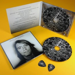 CDs with on-body UV LED printing in four page CD digipaks, with matching printed guitar picks
