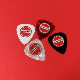 White, black, white oyster shell and tortoiseshell guitar picks with red, black and white on-body print