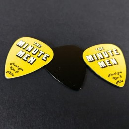 Black guitar picks with a white/yellow on-body print