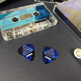 Dark blue guitar picks with a white on-body print