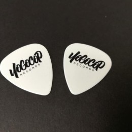 White guitar picks with a black on-body print