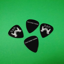 Black guitar picks with a white on-body print