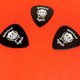 Black guitar picks with white on-body printing produced for Motorhead