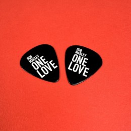 Black guitar picks with white on-body print, created in conjunction with the release of the Bob Marley: One Love film