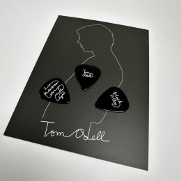 Black guitar picks with white on-body print, produced for Tom Odell