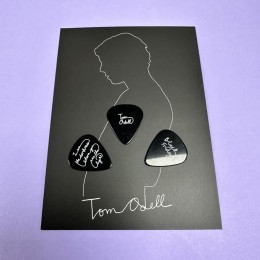 Black guitar picks with white on-body print, produced for Tom Odell